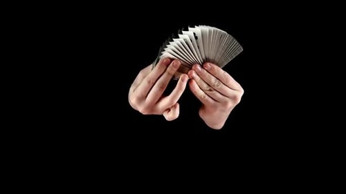 Talanted Magician Showing His Trick with Cards, Like Fan on Black, Slow Motion