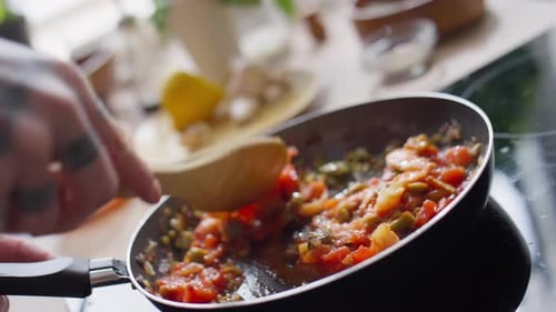 Stirring Vegetables and Shrimp in a Pan