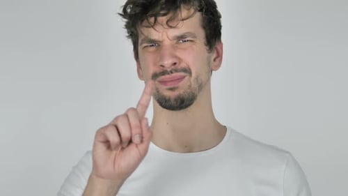 Young Man Giving a Disapproving Hand Gesture