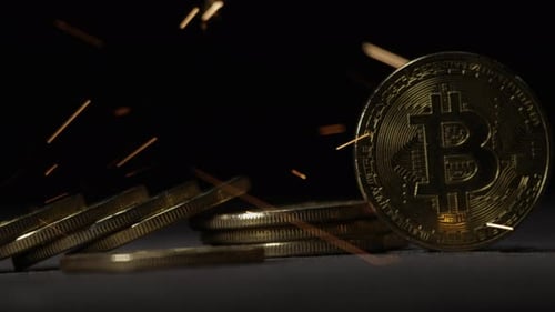 Cryptocurrency on the block chain - close up of bitcoin altcoin physical coins in dynamic setting