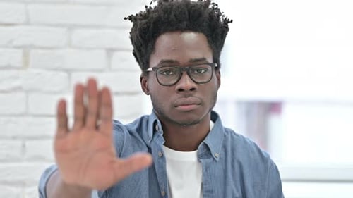 Young African Man Saying No with Hand Sign