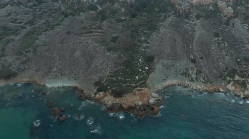 Beautiful Shoreline of Mediterranean Island with Blue Ocean Waves Crashing on Rocks, Aerial Birds