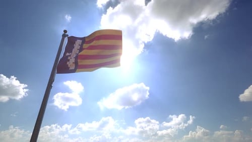 Balearic Islands Flag Waving Against Bright Sunny Sky
