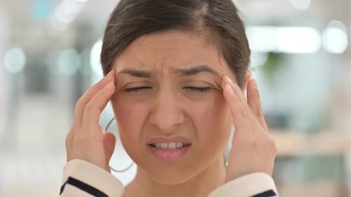 Close Up of Stressed Indian Woman Having Headache