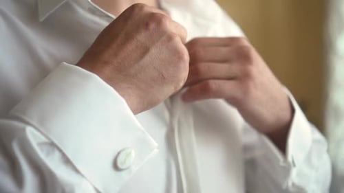 Man Buttons Up White Dress Shirt, Close Up