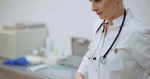 Female Doctor Preparing with Stethoscope in Medical Setting