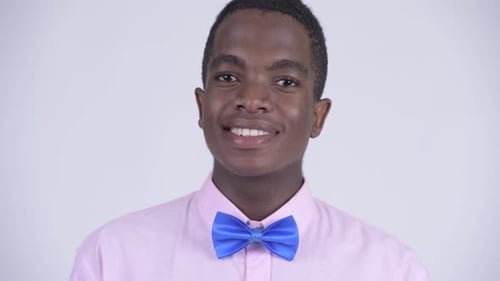 Face of Young Happy African Businessman Smiling