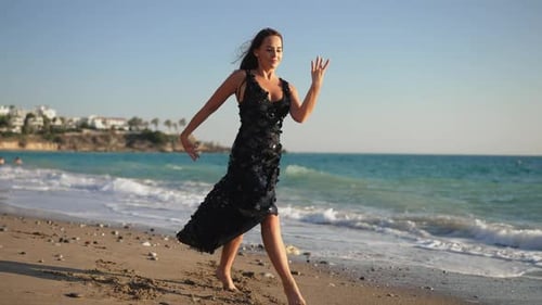 Wide Shot Portrait of Talented Happy Beautiful Female Dancer Walking on Scenic Sandy Sea Beach