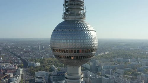 AERIAL: Super Close Up View of the Alexanderplatz TV Tower in Berlin, Germany on Hot Summer Day