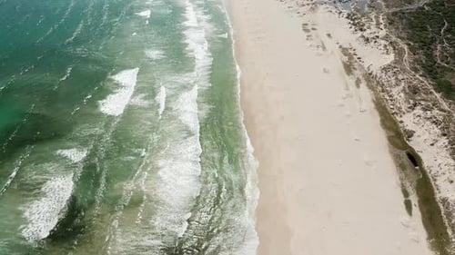 White Sand beach Inbetween Waver and Vegetation