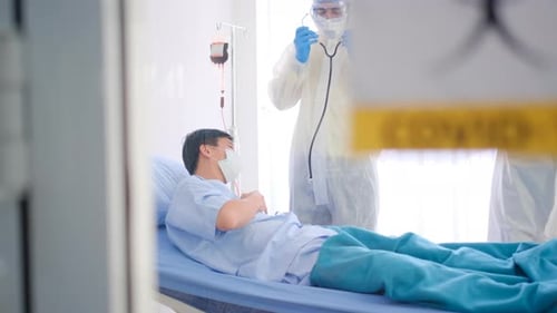 Doctor Examining Patient with Stethoscope in Hospital