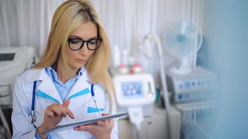 Female Doctor with Tablet Pc in the Hospital