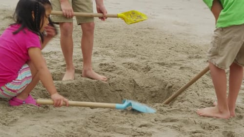 Children playing at beach. Shot on RED EPIC for high quality 4K, UHD, Ultra HD resolution.