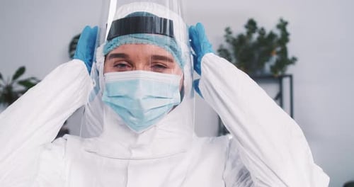 Health Worker Wearing Protective Gear in Hospital