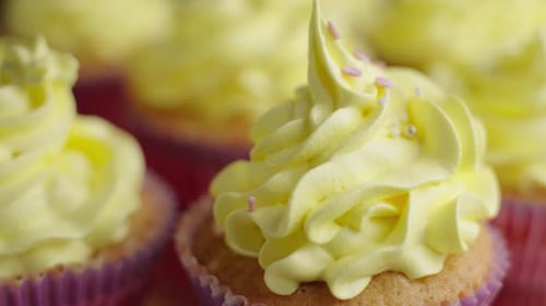 Delicious Cupcakes with Yellow Icing and Sprinkles