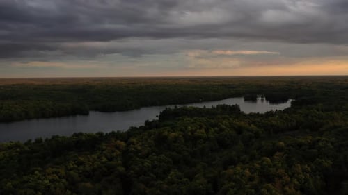 Aerial Summer View Across Green Forest And Lakes At Sun Down 01