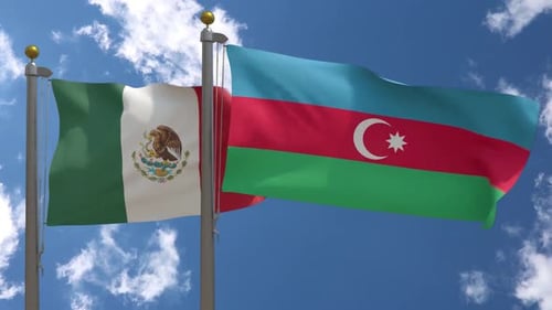 Realistic Waving Flags of Mexico and Azerbaijan Against Blue Sky