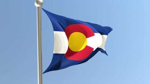 Realistic Colorado State Flag Waving Against Blue Sky