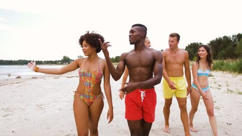 Mixed Walking Along Beach with Friends 21