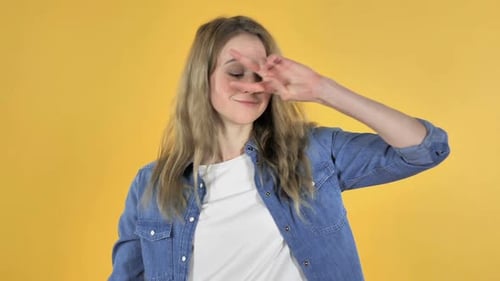 Woman Dancing Against Yellow Background