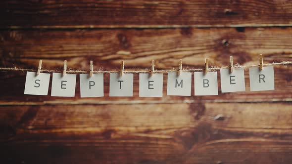 Cards Spelling September Hanging on Wood Background, Holidays Stock ...