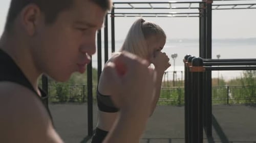 Man and Woman Boxing Workout Outdoors