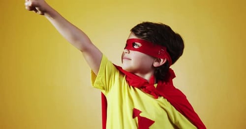 Child Dressed as Super Hero Smiling and Posing