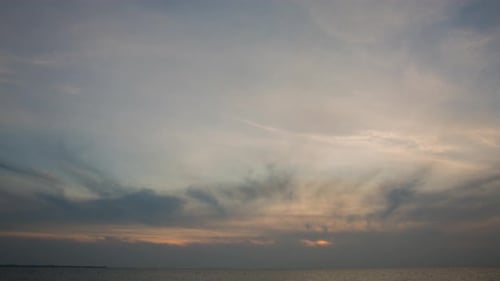 Time Lapse of Clouds at Sunset over Ocean