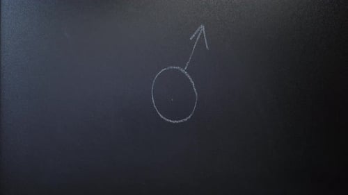 Drawing Male Symbol on a Chalkboard
