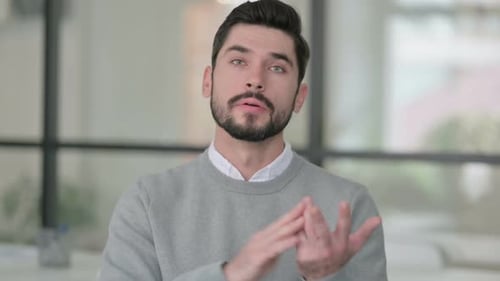 Young Adult Talking to Camera with Hand Gestures