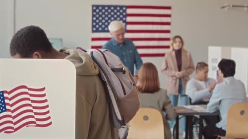 People Voting at Polling Place on Election Day
