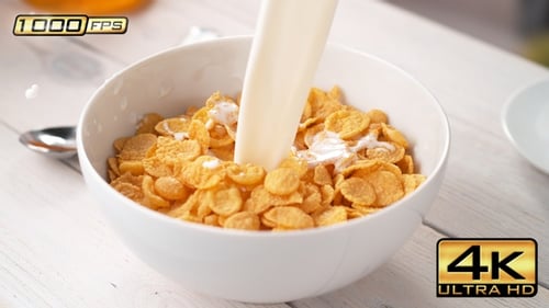Milk Pouring onto Bowl of Corn Flakes