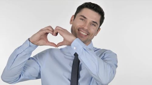 Young Man Makes Heart Shape with Hands