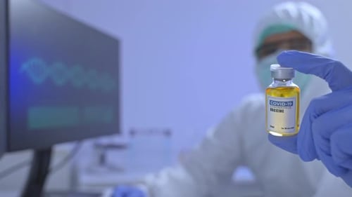 Medical Worker Holds Coronavirus Vaccine Vial