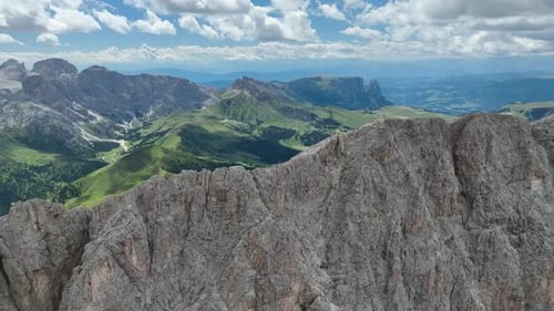 Dolomites mountains peaks with a hiking path on a summer day