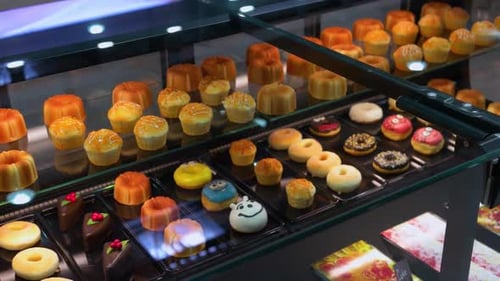 Cream Donuts and Cupcakes in the Bakery Shop