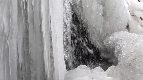 Frozen Waterfall with Pointy Icicles in Winter