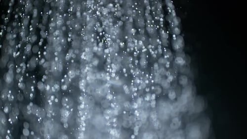 Looped Macro Highspeed Close Up Water Downpour on Black Background