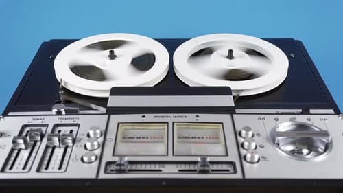 Vintage Reel-to-Reel Tape Recorder Playing Audio