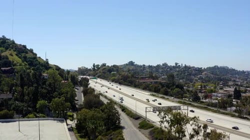 Beautiful aerial view to the cars driving on multi-level highway in Los Angeles.