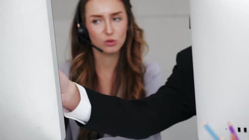 Call center support team consulting together about customer problem