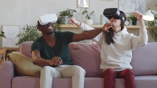 Couple Enjoys Virtual Reality Experience at Home
