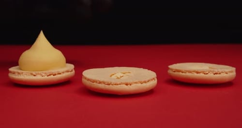 Filling Macarons with Pale Yellow Cream Close Up