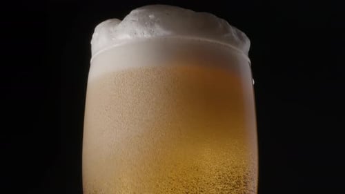Close Up of Golden Beer with Bubbly Foam
