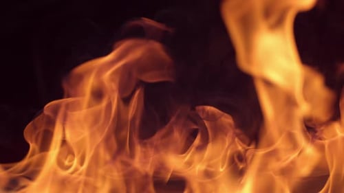 Closeup of fire burning on black background in slow motion; shot on Phantom Flex 4K at 1000 fps