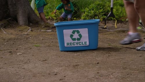 Group of volunteers cleaning up park