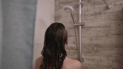 Woman Washing Hair in Modern Shower