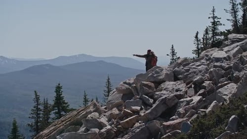 Enjoying View from Top of Mountain
