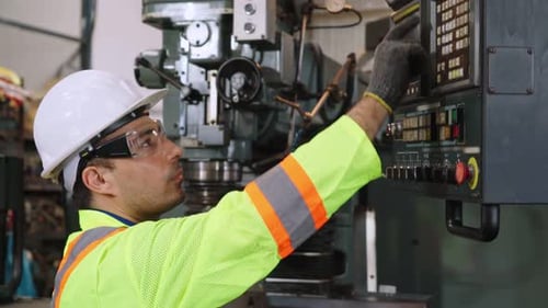 Smart Factory Worker Using Machine in Factory Workshop