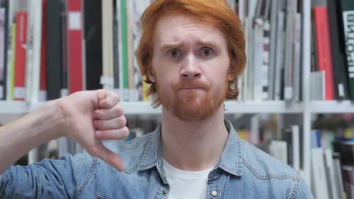 Thumbs Down By Beard Man in Office